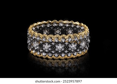 Diamond bracelet with many stones and gold on black background. Designer jewelry - Powered by Shutterstock