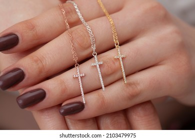 The Diamond Cross Necklace Stands Out In The Woman's Hand. Jewelry Images That Can Be Used In E-commerce, Online Sales And Social Media.