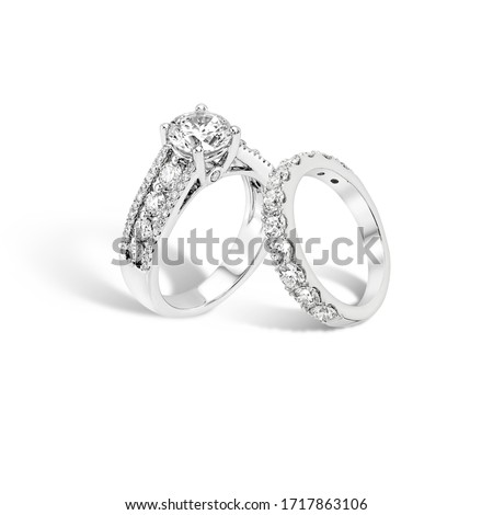 diamond engagement ring and diamond eternity band ring group on white background