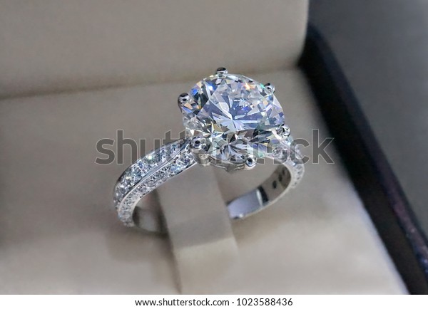 Diamond engagement ring\
isolated in box.