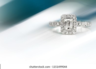 diamond engagement ring on abstract color background