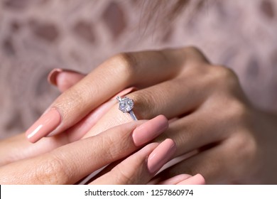 Diamond engagement ring on hand  - Shutterstock ID 1257860974