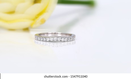 Diamond Eternity Ring On Flower Background