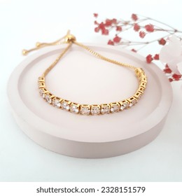 Diamond Gold Sliding Bracelet on Pink Background Woman Jewelry - Shutterstock ID 2328151579