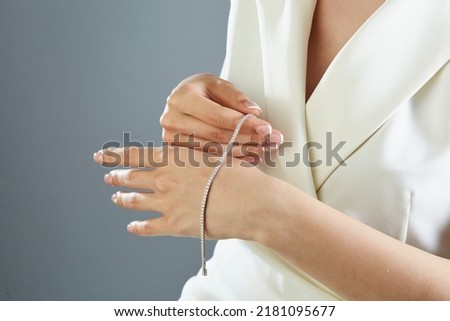 Diamond jewelry. Diamond bracelet on young woman
