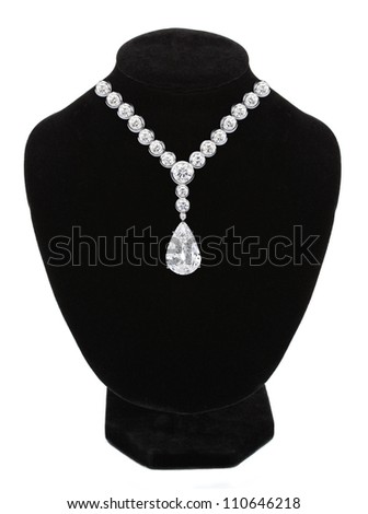 Diamond necklace on black mannequin isolated on white background