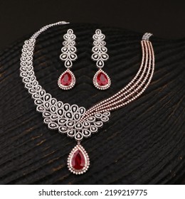 diamond necklace set on black background, shine diamond with red and green stone - Shutterstock ID 2199219775