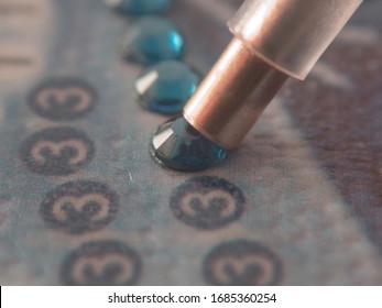 Diamond painting with pen closeup