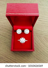 Diamond Ring And Earrings Set  In Red Jewel Box Top View.