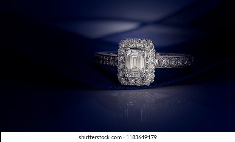 Diamond ring on dark blue background,wedding ring, engagement ring,solitaire - Shutterstock ID 1183649179
