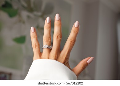 Diamond Ring On A Finger. Holidays And Celebrations Concept.