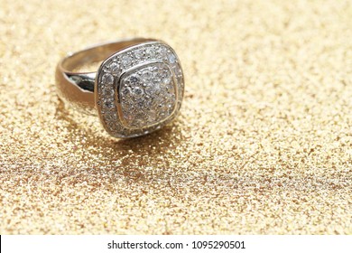 diamond ring on gold glitter background - Shutterstock ID 1095290501