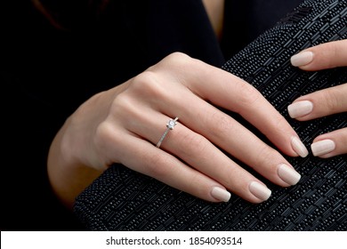 
Diamond Ring On Young Lady's Hand On Black Background