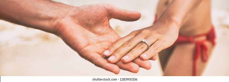 Diamond Ring Wedding Engagement Proposal Hands Of Newlyweds On Beach Banner Panorama. Marriage Proposal With Bands.