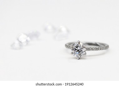 Diamond Rings On White Background White Gold And Rose Gold With Morganite And Lipstick 
