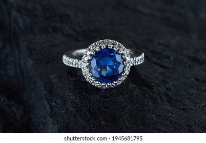 Diamond Sapphire Ring On Black Te￼xtute Background