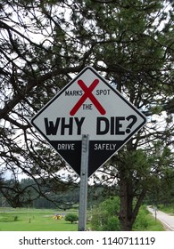 Diamond Shape Road Sign Denoting Driver Awareness.  Be Alert, Don’t Die,with Big Red X Blackens White.