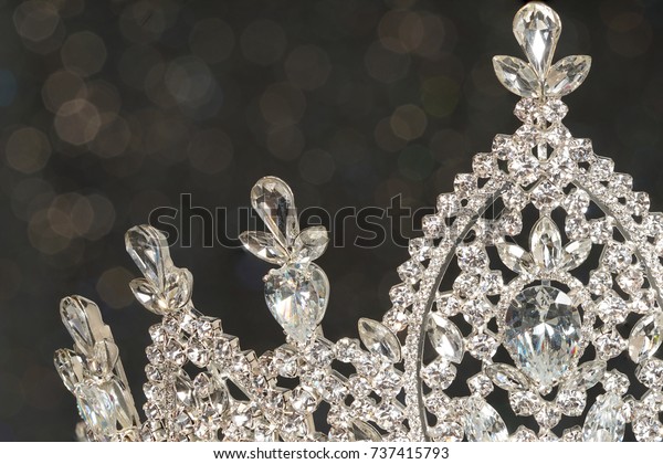 Diamond Silver Crown for Miss\
Pageant Beauty Contest, Crystal Tiara decorate with many shape of\
gems stone and bokeh background, HDR stacking Macro\
photography