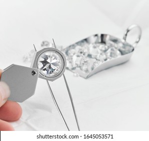 Diamond Viewed Under Magnifying Glass - Grading Diamonds 