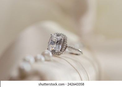 Diamond Wedding Ring  Against Light Blurred Background 