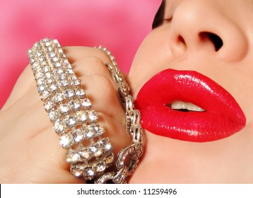 Diamonds Are A Girl's Best Friend, Woman With Red Glossy Lipstick Holding A Diamond Bracelet