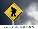 Diamond-shaped crossing sign with yellow background and black border with a troll sign in the middle. 