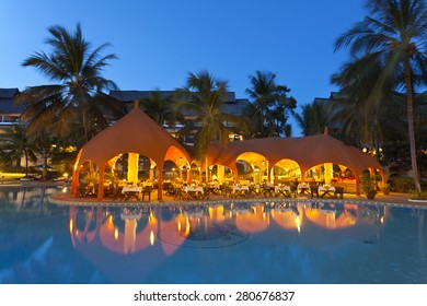 Diani Beach, Kenya - February 17: Restaurant And Illuminated Pool Landscape In The Southern Palms Beach Resort At Night On February 17, 2013