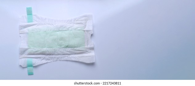 Diaper Open Type For Baby Isolated White Background And Copy Space. Baby Diaper Dry And Soft Texture Fabric White Color Hygienic And Comfortable Tape Type And White Background Studio Shot