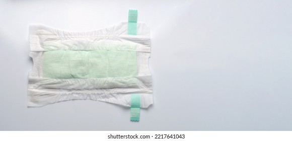 Diaper Open Type For Baby Isolated White Background And Copy Space. Baby Diaper Dry And Soft Texture Fabric White Color Hygienic And Comfortable Tape Type And White Background Studio Shot