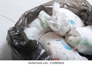 Diapers Waste, Dirty Diapers In Trash Bag. Disposing Of Used Baby Nappies.