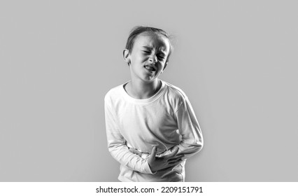 Diarrhea Or Gastroenteritis Health Problem. Child Has Stomachache With Food Poisoning. Child Holding Hands On Belly. Black And White.