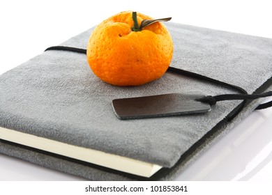 diary book and orange
