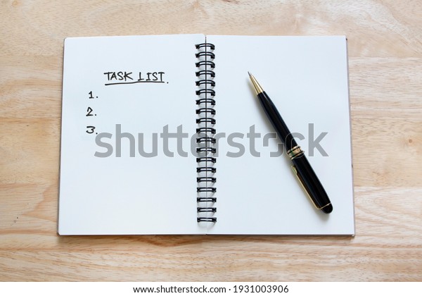 diary book with word task list , to do list
concept, deciding to do something
