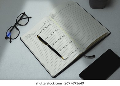 A diary or notebook open on a white desk with the phrase 