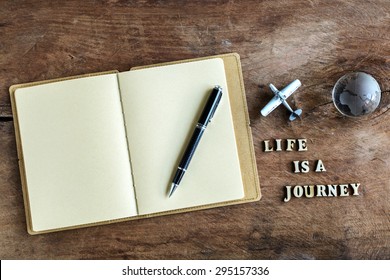 Diary On Wooden Background With Word 