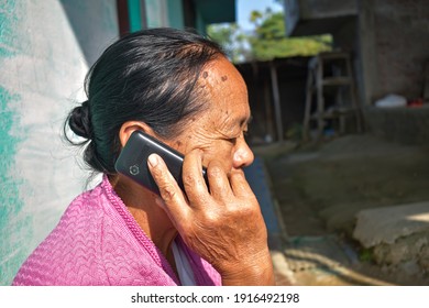 DIBRUGARH, ASSAM, INDIA-12 JULY 2020:old Lady Talking On Mobile Phone. 