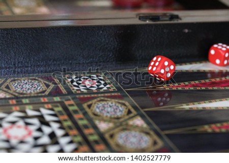 Dice and a backgammon board.