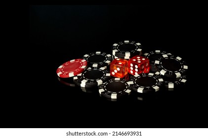 Dice And Chips Obtained From Winnings While Playing Craps. The Idea Of The Game On A Black Background With Space For Advertising