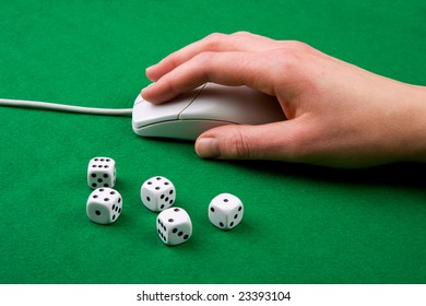 Dice and a computer mouse on a green background. - Online Gaming concept