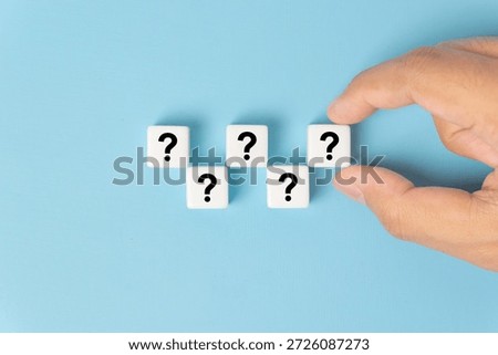 Dice cube block shape with sign question mark symbol on blue background