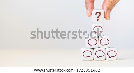 Dice cube with question mark and Speech bubbles comment icon on table.FAQ( frequency asked questions), Answer, QA, admin, Communication, comments in social networks.messenger, SMS, Feedback. leader.