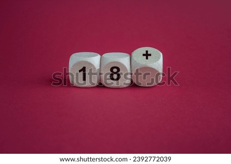 Dice form the expression 18 plus . Symbol for a age restriction. Beautiful red background. Copy space.