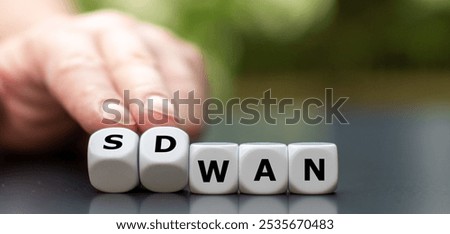 Dice form the expression 'SD WAN'. Symbol for  Software defined Wide Area Networking.