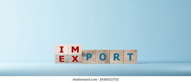 Dice form the words Import export wooden cubes.