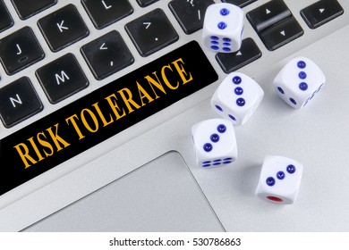 Dice And Keyboard. Business Risk Concept With Risk Tolerance Words.