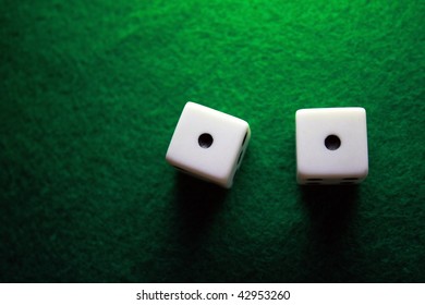 Dice Over A Green Table Showing Snake Eyes