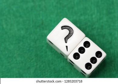 Dice and question mark.
