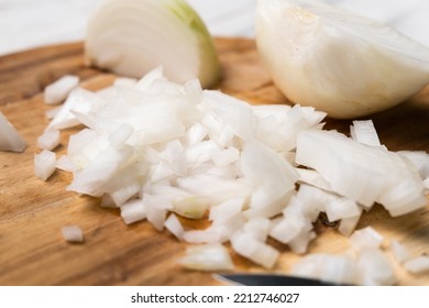 Diced Onion On A Wooden Cutting Board. Sliced White Onion.