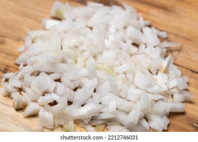 Diced Onion On A Wooden Cutting Board. Sliced White Onion.