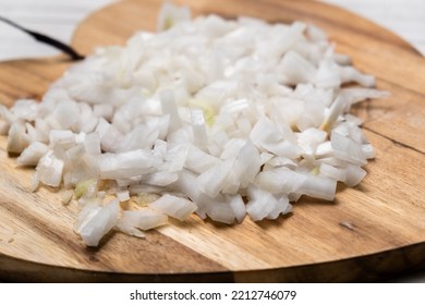 Diced Onion On A Wooden Cutting Board. Sliced White Onion.